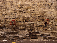 brick supports in old stone wall